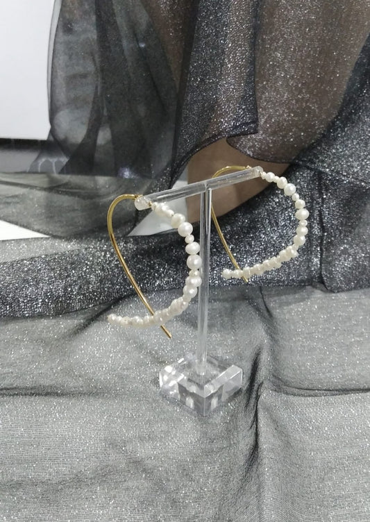 Pendientes acero con perlas.