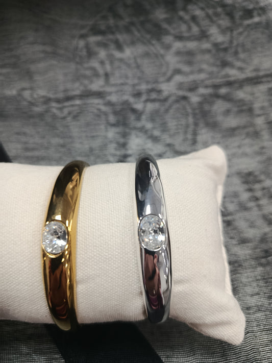 Brazalete acero rígido, plateado y dorado con cristal en el centro, Moments