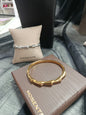 Brazalete acero rígido, dorado y plateado, Moments