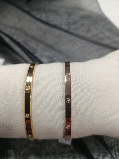 Pulsera, brazalete, rígido cerrado, dorado, plateado y dorado rosa con cristal, Moments
