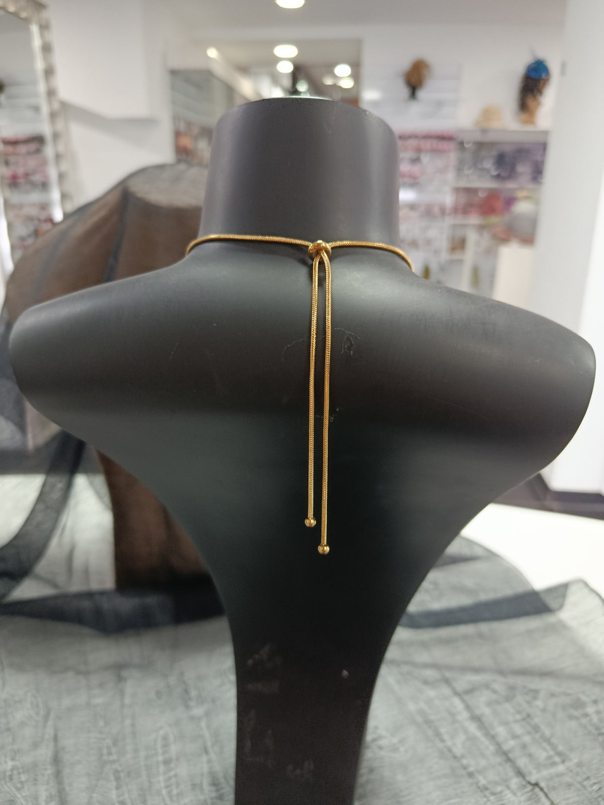 Colgante acero dorado ajustable